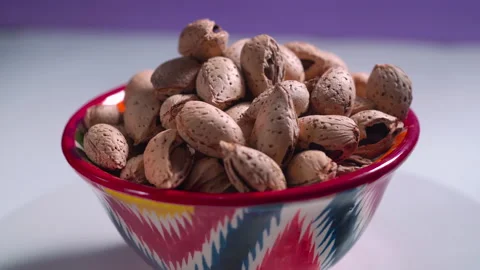 A cup with almonds rotates close-up Stock Footage 159157062
