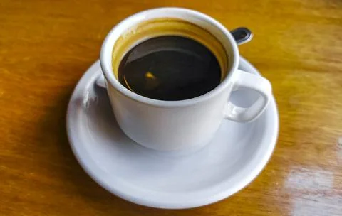 Cup of americano black coffee in restaurant cafe in Mexico. Stock Photos