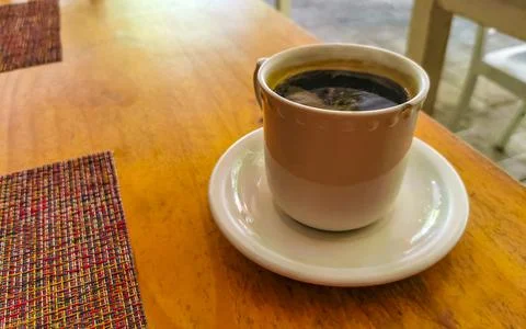 Cup of americano black coffee in restaurant cafe in Mexico. Stock Photos