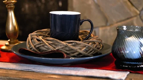 Cup and candle on the table Stock Footage 98516549