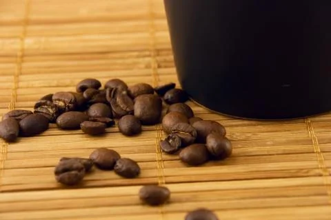 Cup and coffee beans Stock Photos