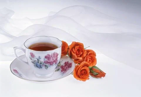 Cup And Flowers Stock Photos