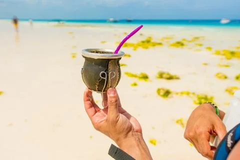 Cup with argentinian mate in hand Stock Photos