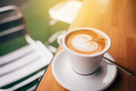A cup of aromatic cappuccino. Stock Photos