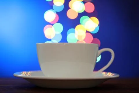 Cup on the background of lights Stock Photos