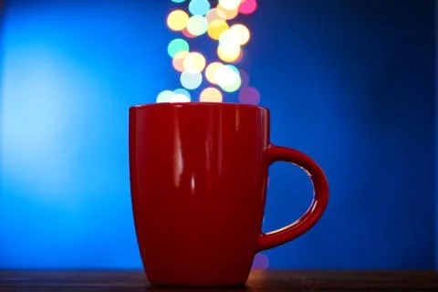 Cup on the background of lights Stock Photos