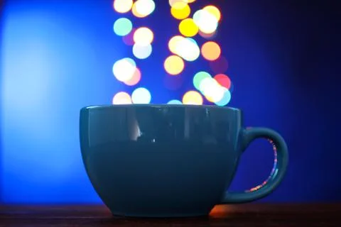 Cup on the background of lights Stock Photos