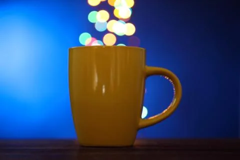 Cup on the background of lights Stock Photos