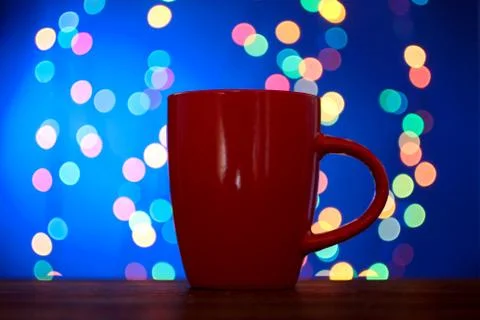 Cup on the background of lights Stock Photos