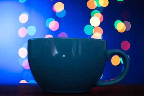 Cup on the background of lights Stock Photos