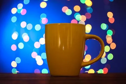 Cup on the background of lights Stock Photos