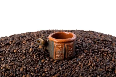 A cup of beans of coffee background Stock Photos