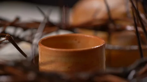 Cup being filled with wine with Crown of Thorns Surrounding Cup Vídeos de archivo 128556615