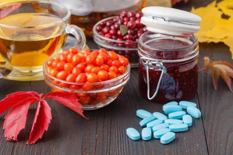 Cup of berry tea instead of pills concept of nature medicine Stock Photos