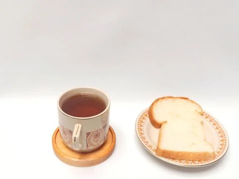 Cup of Black Coffee and Slice of White Bread Eye Level Studio Foto stock