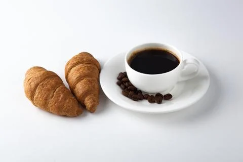 Cup of black coffee with croissants 写真素材