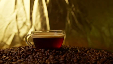 Cup Black Coffee On Ratating Roasted Coffee Beans. Stockbeeldmateriaal 195283211