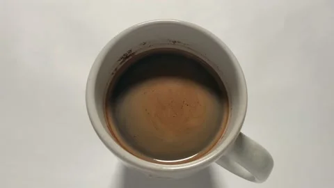 A cup of black coffee is ready to be served on white background Stock Footage 164601719