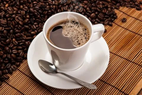 Cup of black coffee with roasted coffe beans Stock Photos