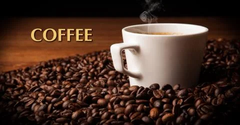 Cup of black coffee with roasted coffe beans Stock Photos