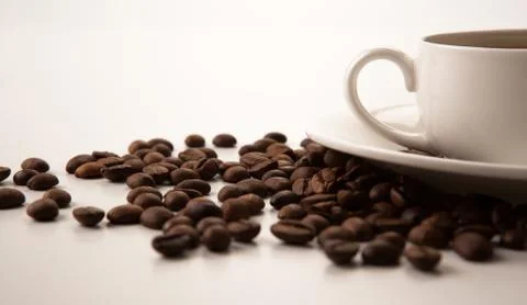 Cup of black coffee with roasted coffe beans Stock Photos
