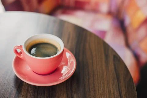 Cup of black coffee on a table in a cafe. \ Stock Photos