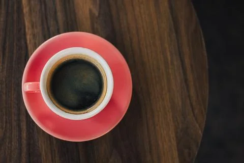 Cup of black coffee on a table in a cafe. Stock Photos