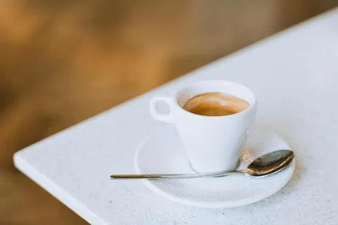 Cup of black coffee on a table in a cafe. Stock Photos
