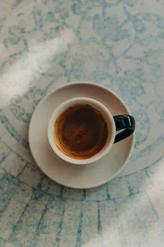 Cup of black coffee on a table in a cafe. Top view. Stock Photos
