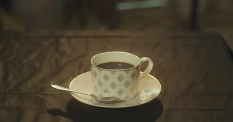 A cup of black coffee on the table Stock Footage 130575629