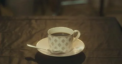 A cup of black coffee on the table Stock Photos