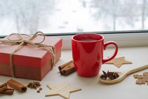 Cup of black coffee on a winter window sill Stock Photos