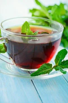 Cup of black mint tea Stock Photos