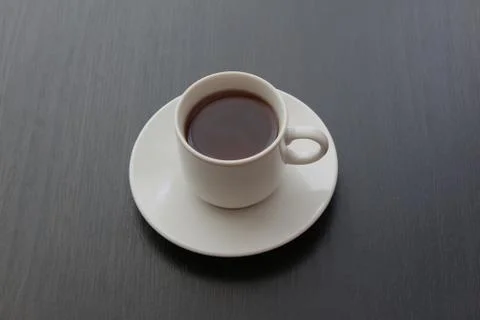 Cup of black tea on gray background Stock Photos