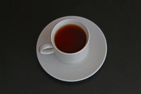 Cup of black tea on gray background Stock Photos
