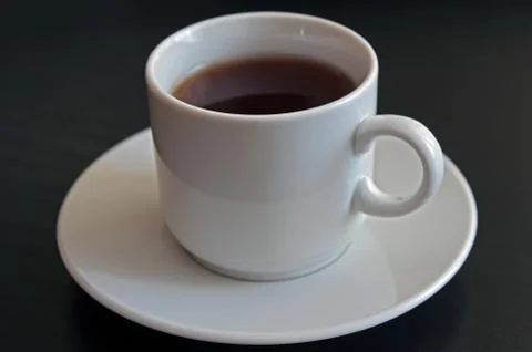 Cup of black tea on gray background Stock Photos