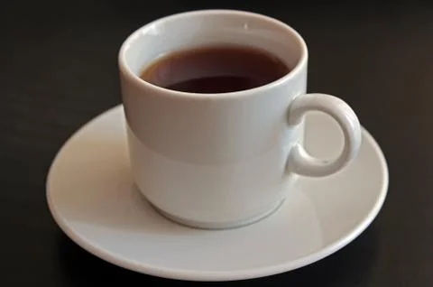 Cup of black tea on gray background Stock Photos