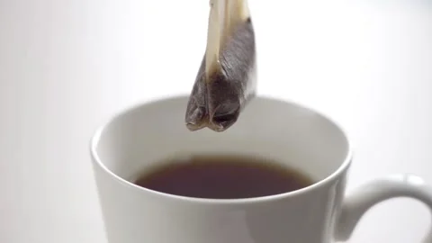 Cup of black tea isolated on white Stock Footage 147086136