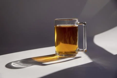 A cup of black tea, isolated on a white background with shadows with splashes Stock-Fotos