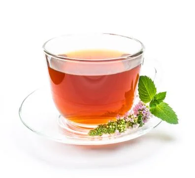 Cup of black tea with mint leaves and flower Stock Photos