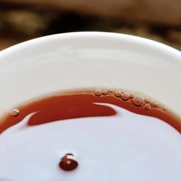 Cup with black tea Stock Photos