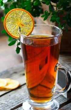 Cup of black tea with a slice of dried orange Stock-Fotos