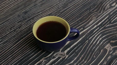 A cup with black tea on the table Stock Footage 63176352