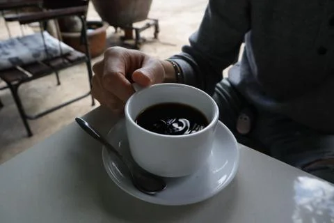 Cup of black Weasel coffee at a coffee farm in Vietnam. Stock Photos