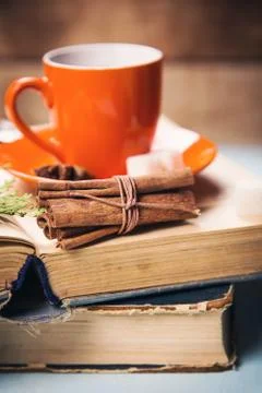 Cup on the book Stock Photos