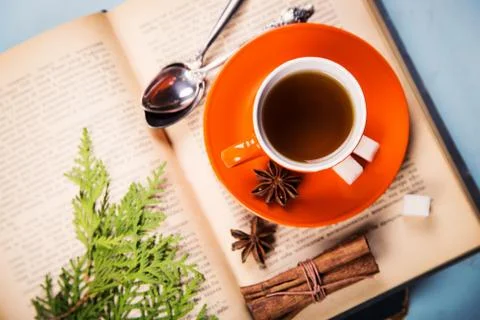 Cup on the book Stock Photos