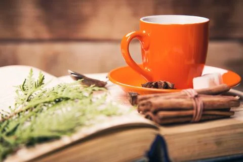 Cup on the book Stock Photos