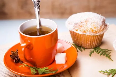 Cup on the book Stock Photos