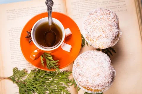 Cup on the book Stock Photos