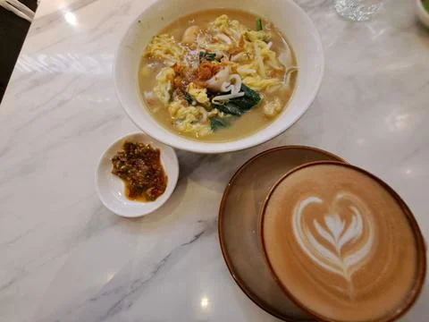 A Cup of Caffe Latte with Heart Latte Art Served with Scrambled Egg Instant Nood Stock Photos